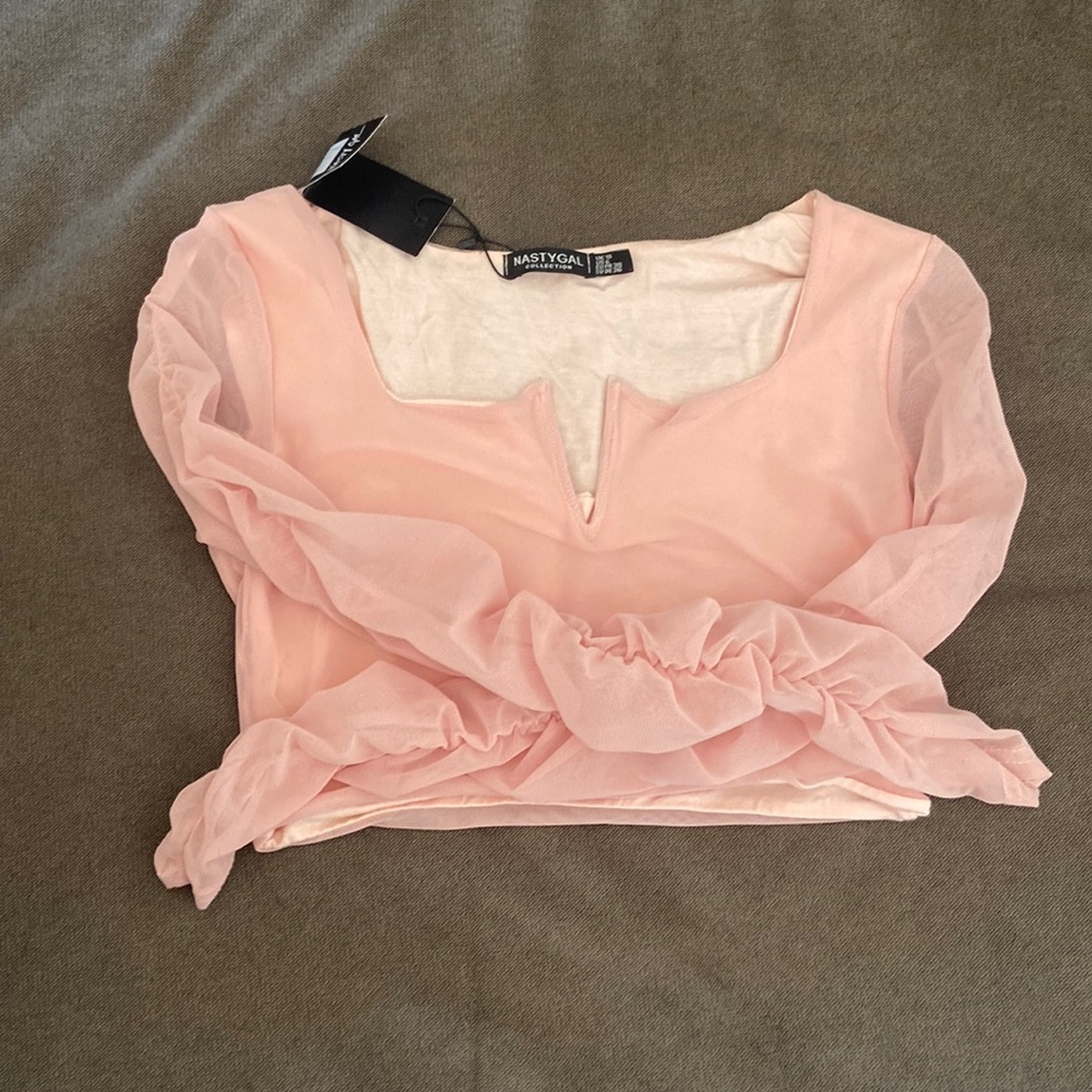 Mesh ruched v bar micro top in the color rose.